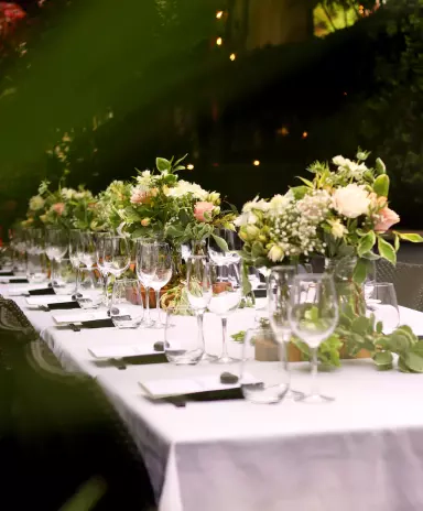 Beautifully set table with flowers and dishes